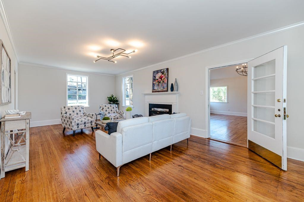 2618 Wade Avenue Raleigh, NC 27607 - Photo 22 of 62 a living room with fireplace furniture and a wooden floor