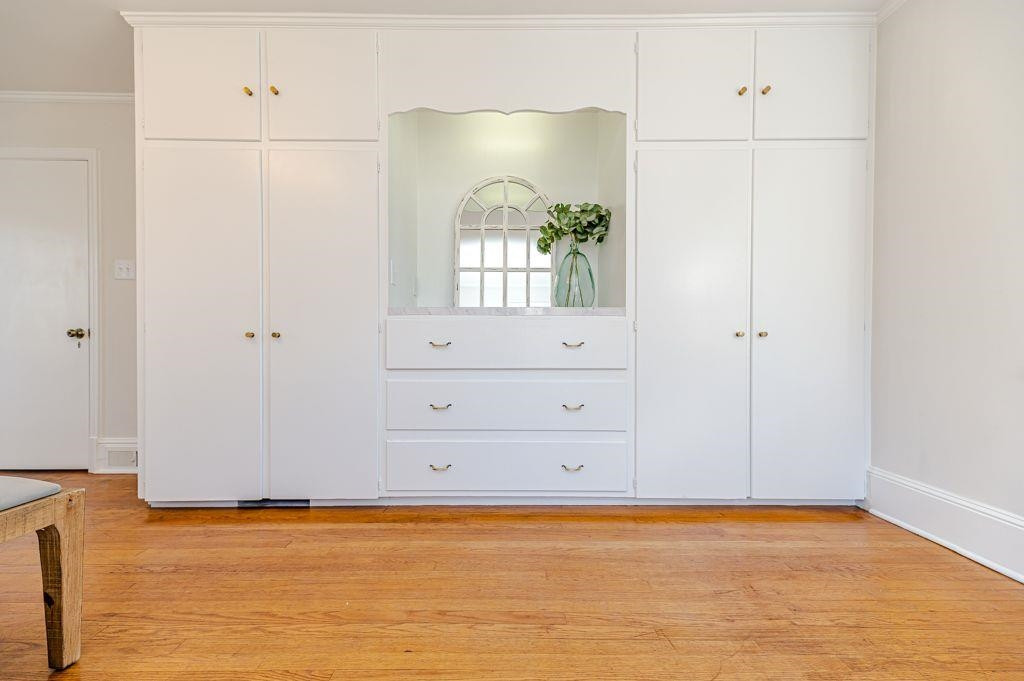 2618 Wade Avenue Raleigh, NC 27607 - Photo 29 of 62 a view of a room with wooden floor and cabinet