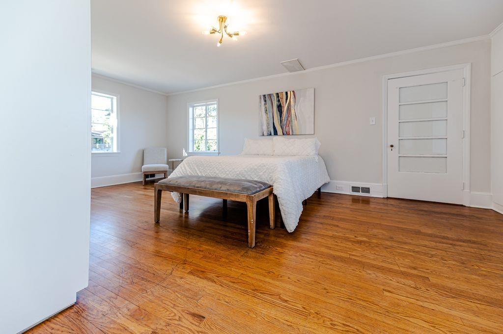 2618 Wade Avenue Raleigh, NC 27607 - Photo 31 of 62 a bedroom with a bed and a table