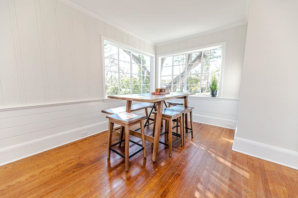 2618 Wade Avenue Raleigh, NC 27607 - Photo 37 of 62 a view of a dining room with furniture and wooden floor