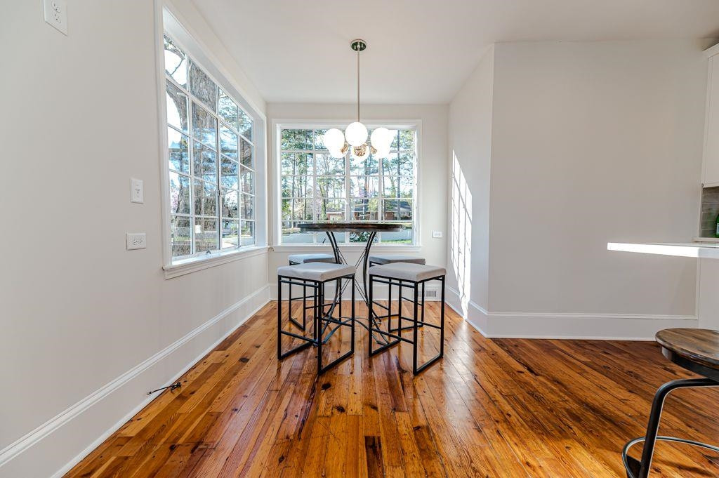 2618 Wade Avenue Raleigh, NC 27607 - Photo 40 of 62 a workspace room with furniture window and wooden floor