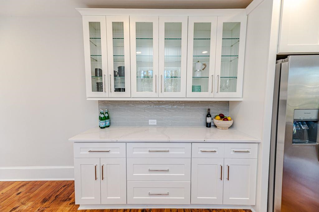 2618 Wade Avenue Raleigh, NC 27607 - Photo 42 of 62 a kitchen with white cabinets and a window