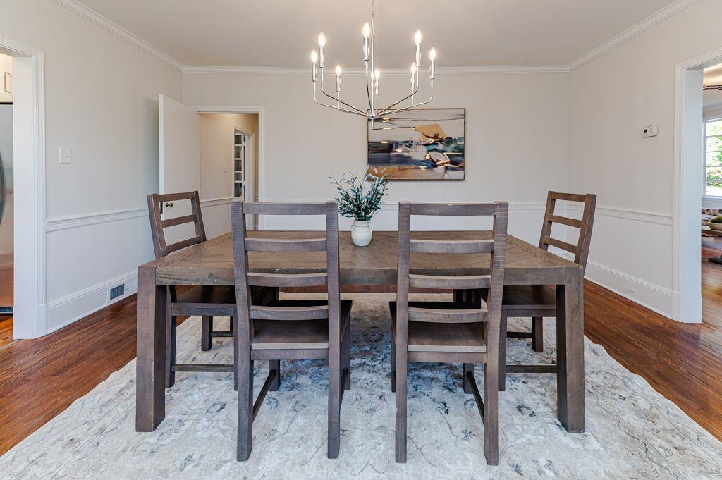 2618 Wade Avenue Raleigh, NC 27607 - Photo 46 of 62 a view of a dining room with furniture and wooden floor