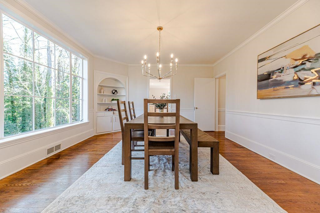 2618 Wade Avenue Raleigh, NC 27607 - Photo 47 of 62 a view of a dining room with furniture window and wooden floor