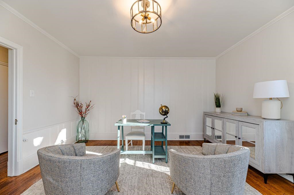 2618 Wade Avenue Raleigh, NC 27607 - Photo 49 of 62 a living room with furniture and a table