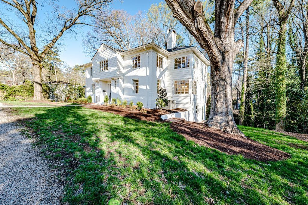 2618 Wade Avenue Raleigh, NC 27607 - Photo 55 of 62 a view of an house with backyard and trees