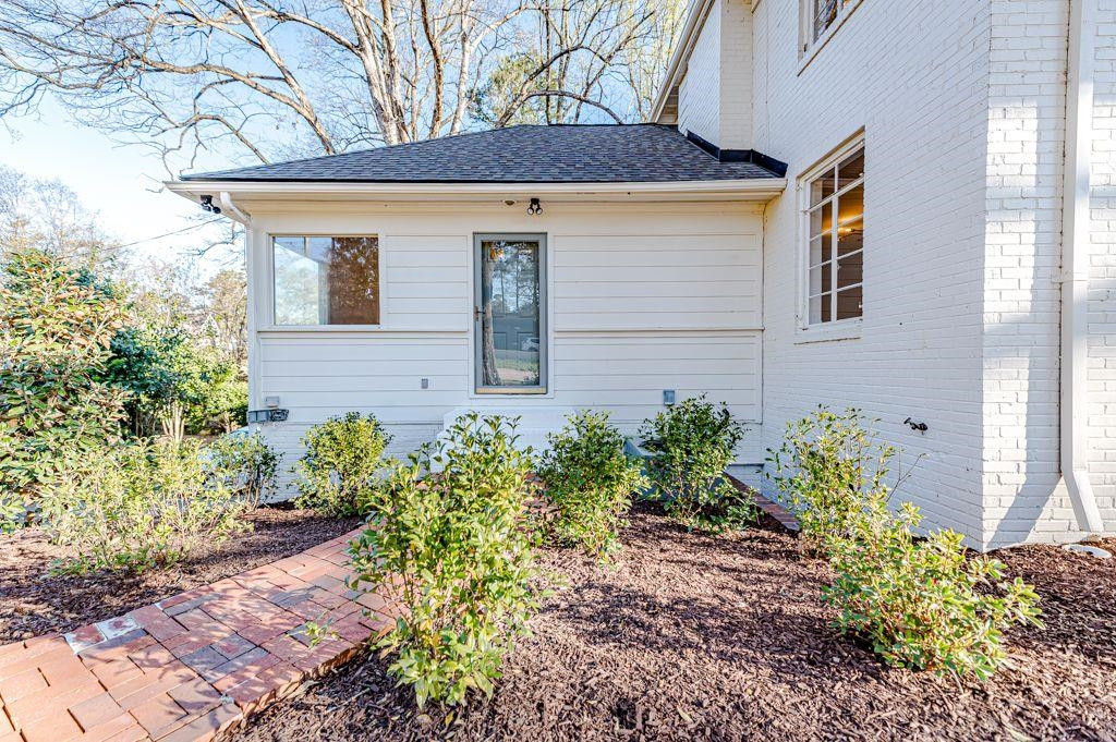2618 Wade Avenue Raleigh, NC 27607 - Photo 60 of 62 a front view of a house with garden