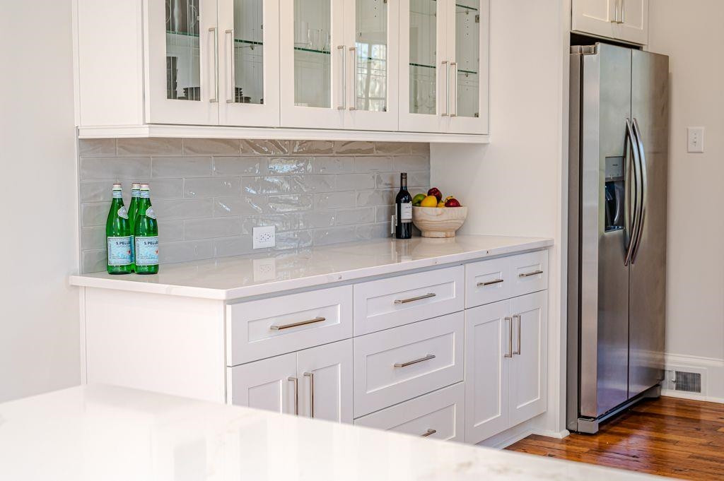 2618 Wade Avenue Raleigh, NC 27607 - Photo 6 of 62 a kitchen with stainless steel appliances white cabinets and a refrigerator