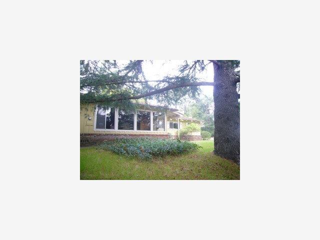 a upper view of a house with a yard