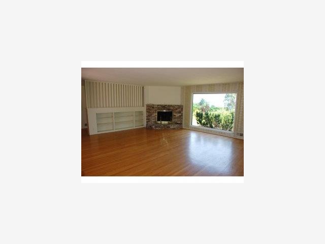 11001 Magdalena Road Los Altos Hills, CA 94024 - Photo 3 of 9 a open hall with a fireplace