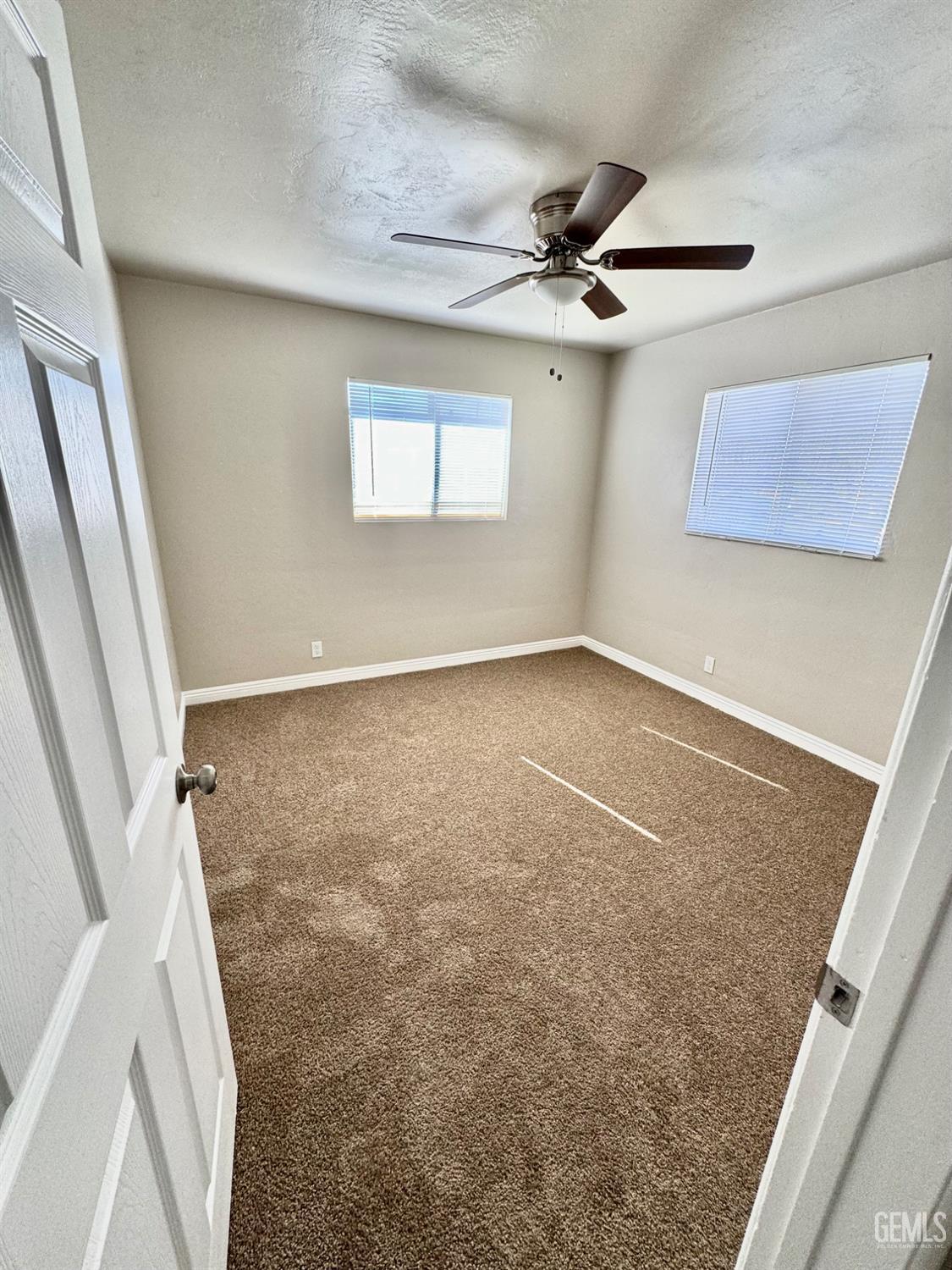 Undisclosed Address Delano, CA 93215 - Photo 6 of 11 en empty room with windows