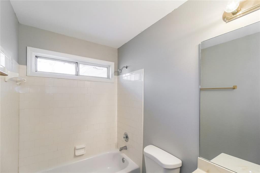 4358 Wesleyan Pointe Decatur, GA 30034 - Photo 11 of 30 a bathroom with a toilet and shower