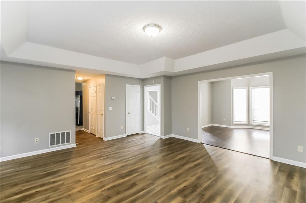 4358 Wesleyan Pointe Decatur, GA 30034 - Photo 5 of 30 a view of empty room with wooden floor and fan