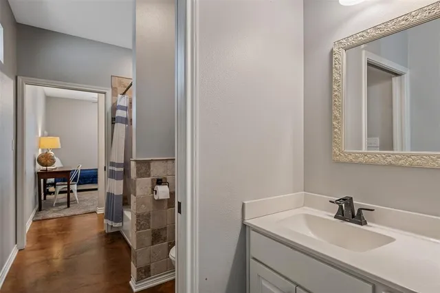 a bathroom with a sink and a mirror
