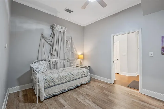 a bedroom with a bed and a mirror