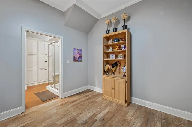 wooden floor with white cabinets and wooden floor