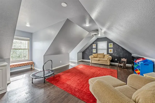 a living room with furniture bathtub and a window