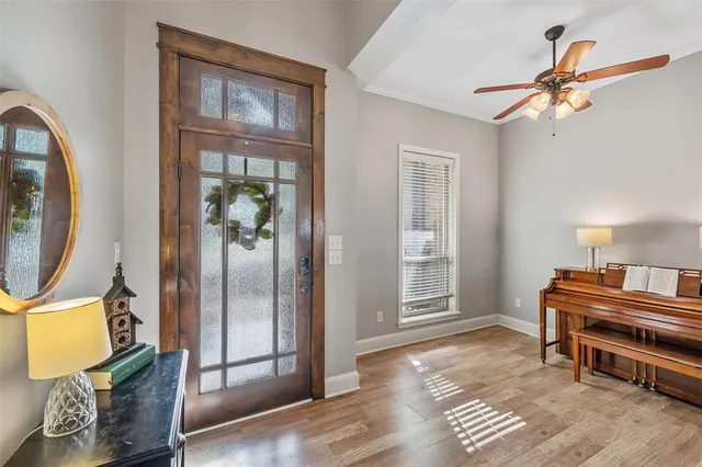 a view of a livingroom with furniture and windows
