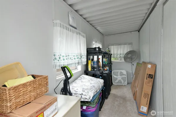 a view of workspace with furniture and window