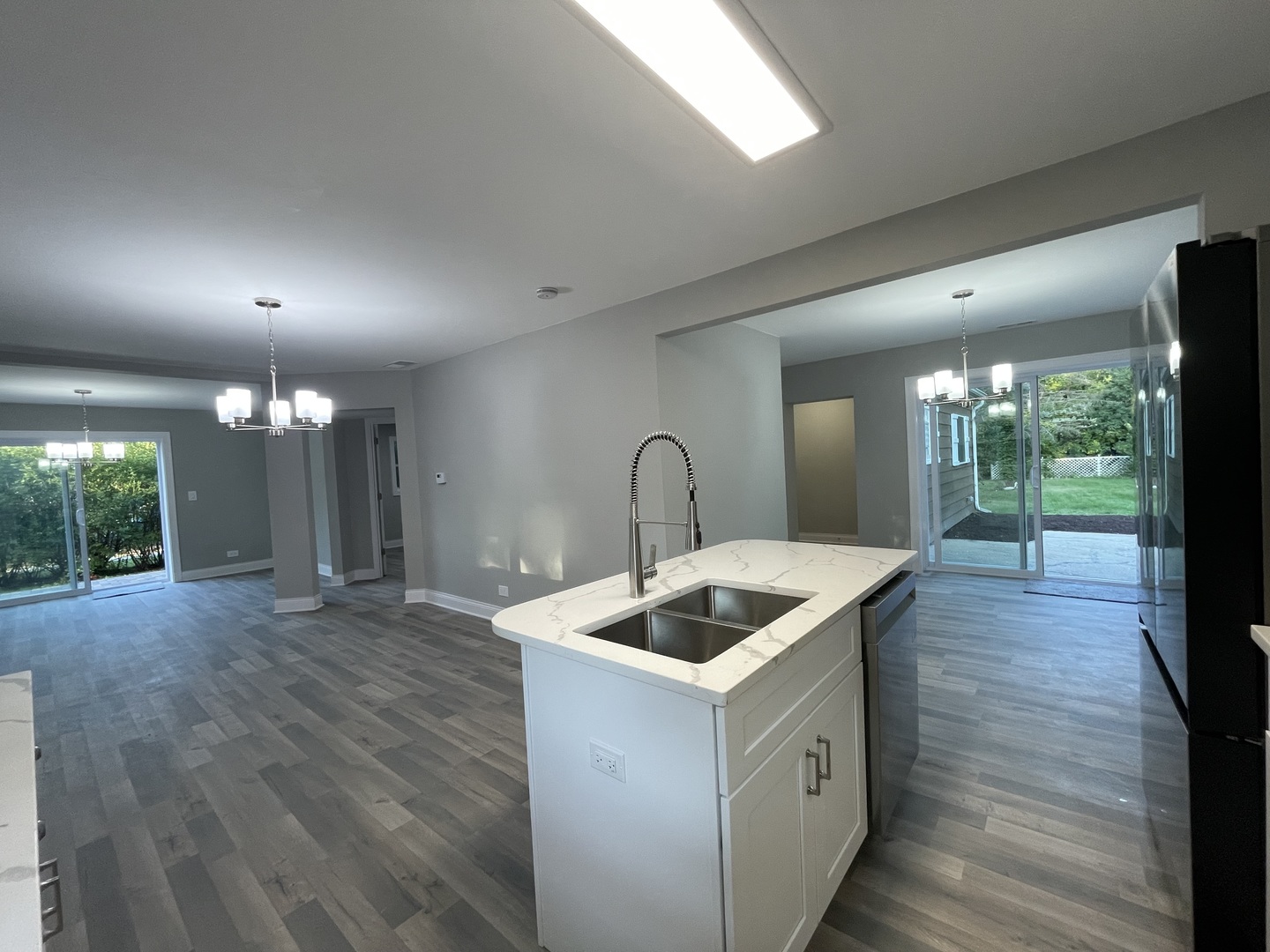 5547 South Peck Avenue Countryside, IL 60525 - Photo 12 of 26 a kitchen that has a sink and a wooden floor