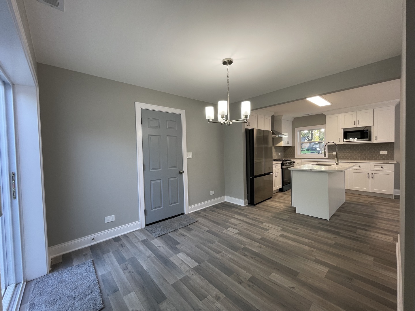 5547 South Peck Avenue Countryside, IL 60525 - Photo 13 of 26 a view of a kitchen with a sink and dishwasher wooden floor