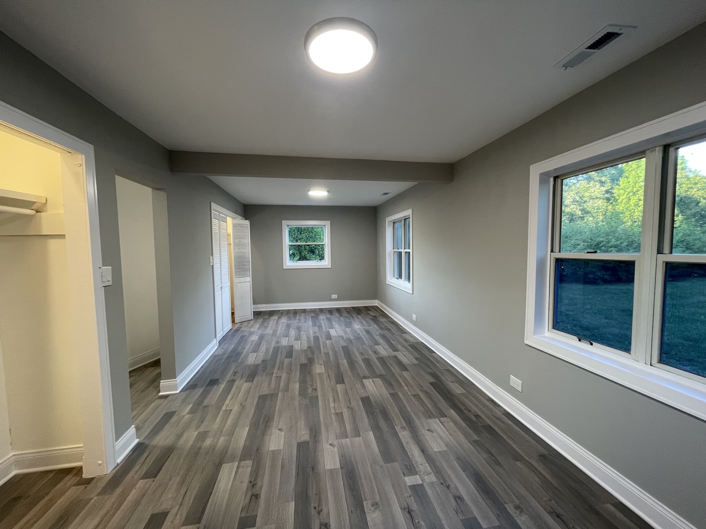 5547 South Peck Avenue Countryside, IL 60525 - Photo 15 of 26 wooden floor in an empty room with a window