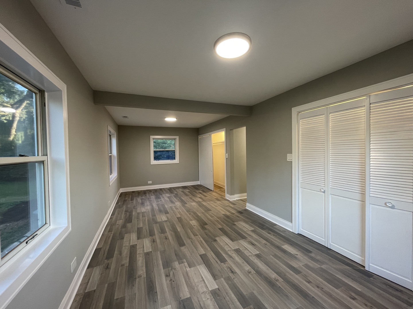 5547 South Peck Avenue Countryside, IL 60525 - Photo 16 of 26 wooden floor in an empty room with a window
