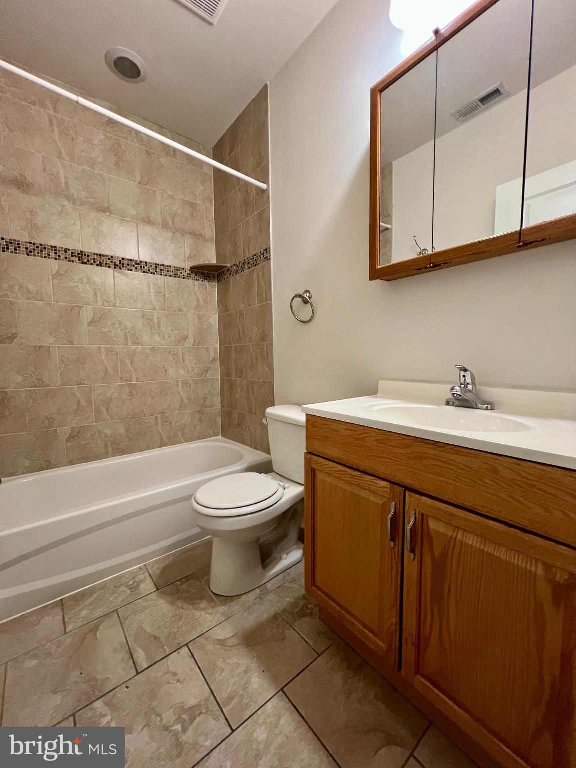 2106 North 17th Street, Unit 2 Philadelphia, PA 19121 - Photo 17 of 31 a bathroom with a sink a toilet and shower