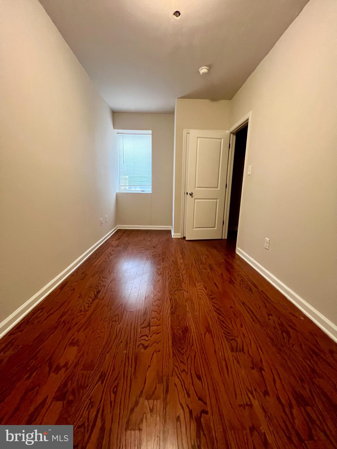 2106 North 17th Street, Unit 2 Philadelphia, PA 19121 - Photo 19 of 31 wooden floor in an empty room with a window