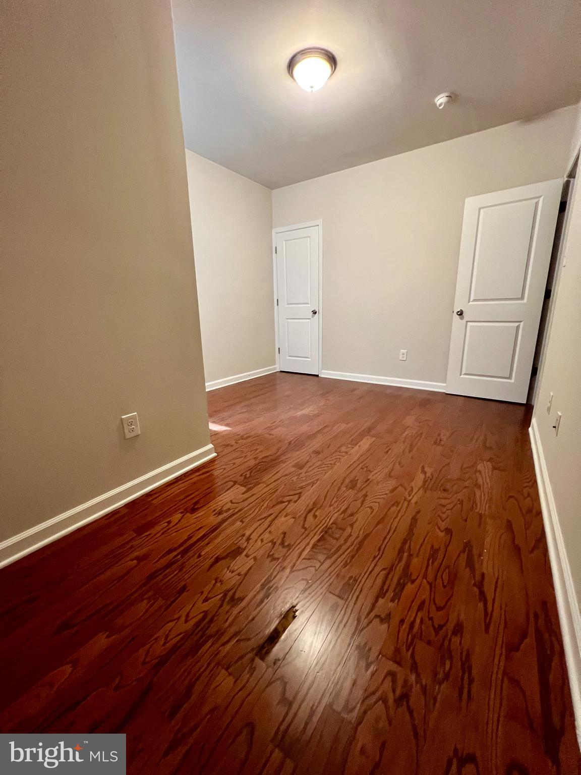2106 North 17th Street, Unit 2 Philadelphia, PA 19121 - Photo 21 of 31 an empty room with wooden floor
