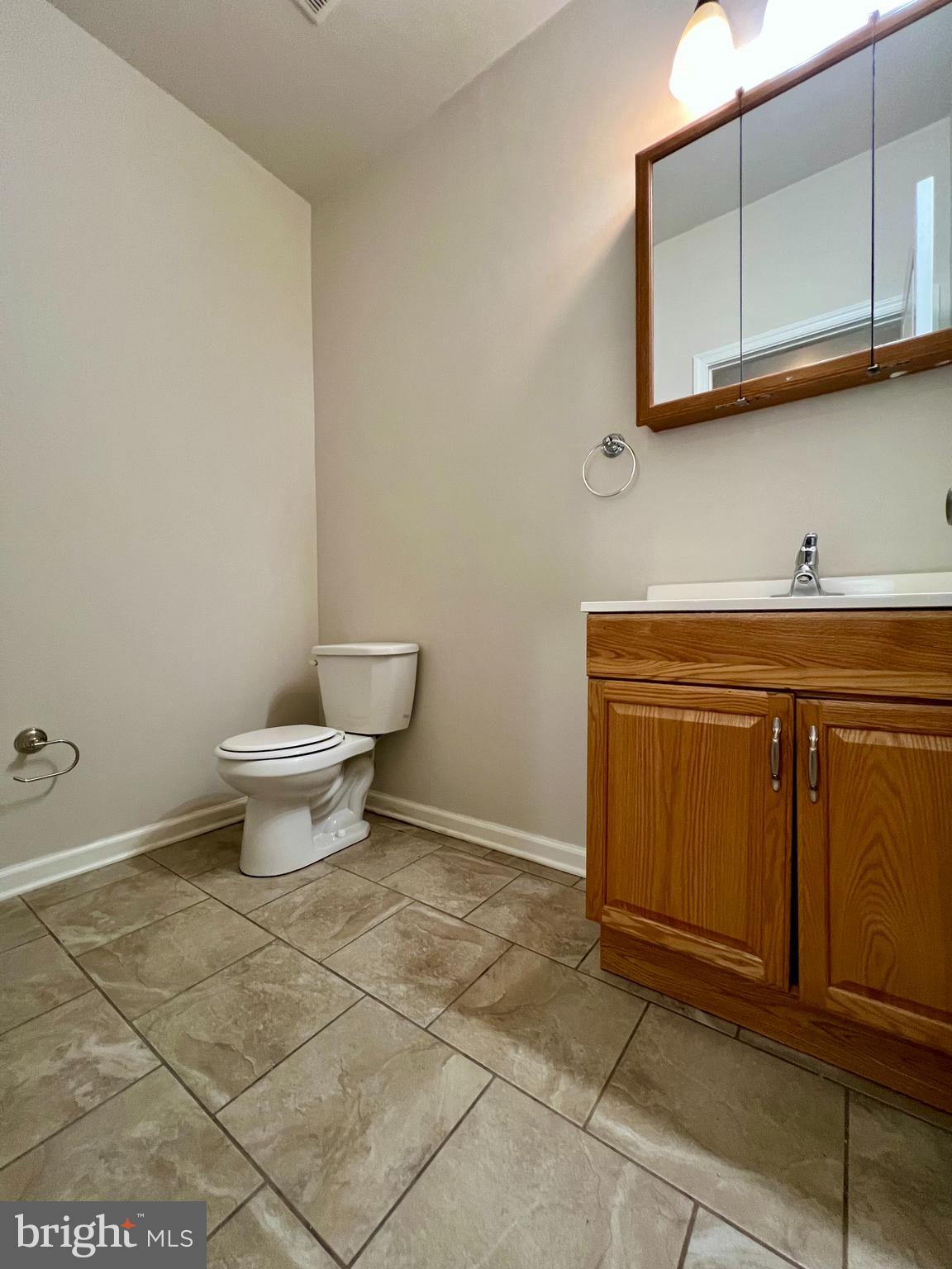 2106 North 17th Street, Unit 2 Philadelphia, PA 19121 - Photo 10 of 31 a bathroom with a sink a toilet and mirror