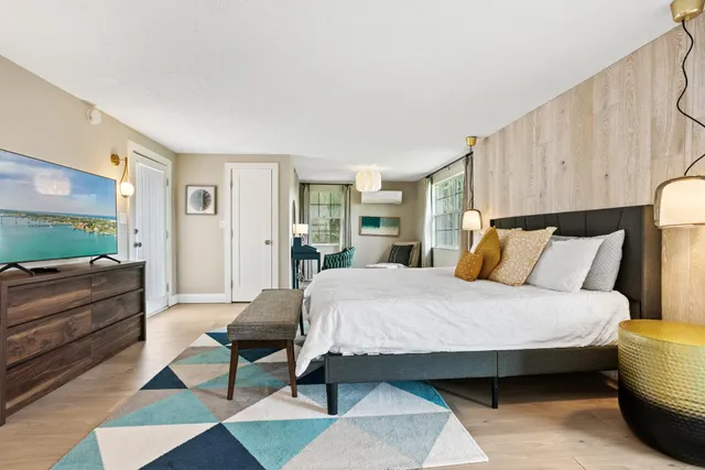 a bathroom with double sink and a mirror