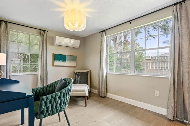 a bathroom with a tub and a window