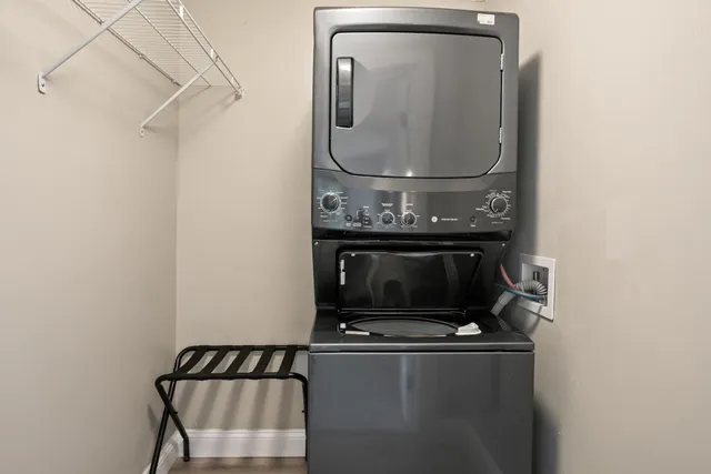a view of a patio with table and chairs potted plants with wooden floor