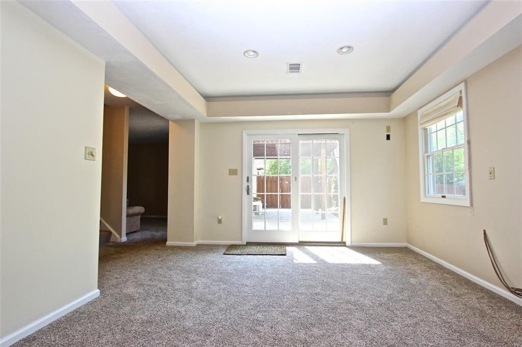 123 Bower Hill Road Venetia, PA 15367 - Photo 16 of 23 Downstairs bonus room that is plumber for a bar and opens up to the patio and pool! Recessed lighting and tray ceiling adds to the appeal of this wonderful space!
