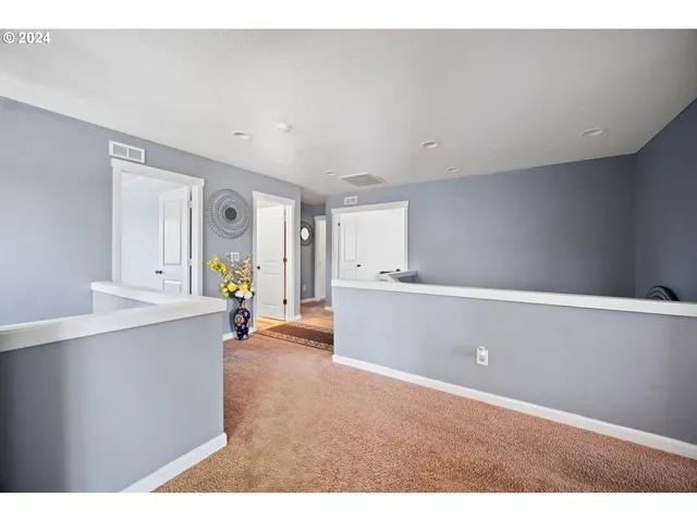 a view of a kitchen with wooden floor
