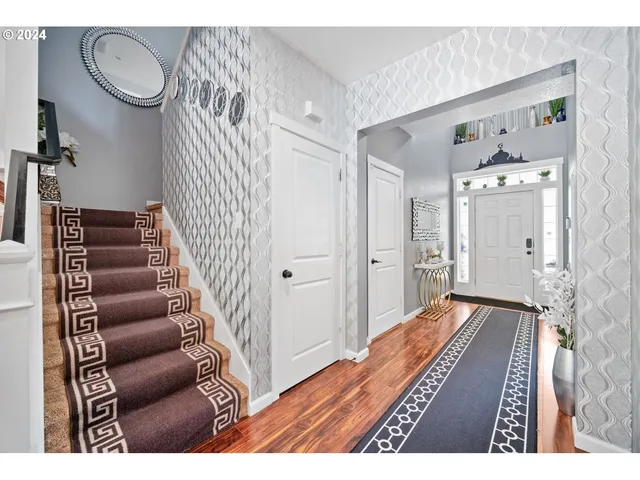 a view of an entryway with wooden floor