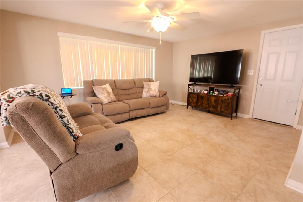 3629 Haven Drive New Port Richey, FL 34652 - Photo 15 of 20 a living room with furniture and a flat screen tv