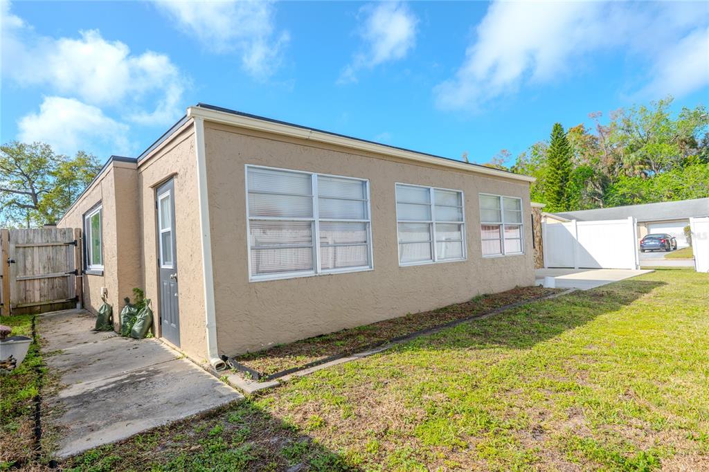 3629 Haven Drive New Port Richey, FL 34652 - Photo 17 of 20 a view of backyard with a garden and plants