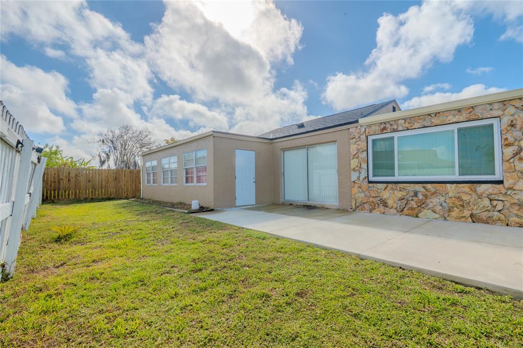 3629 Haven Drive New Port Richey, FL 34652 - Photo 18 of 20 a view of a house with a yard and garage