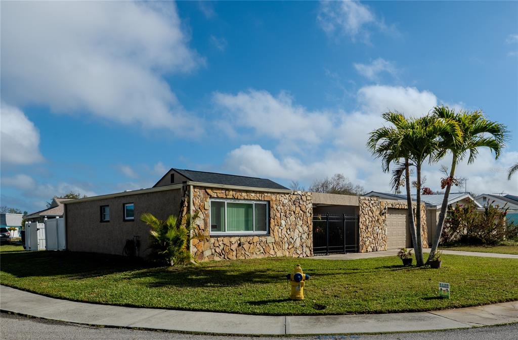 3629 Haven Drive New Port Richey, FL 34652 - Photo 3 of 20 a front view of a house with garden