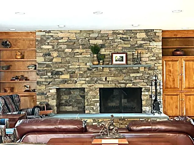 a bedroom with a bed and a lamp on dresser