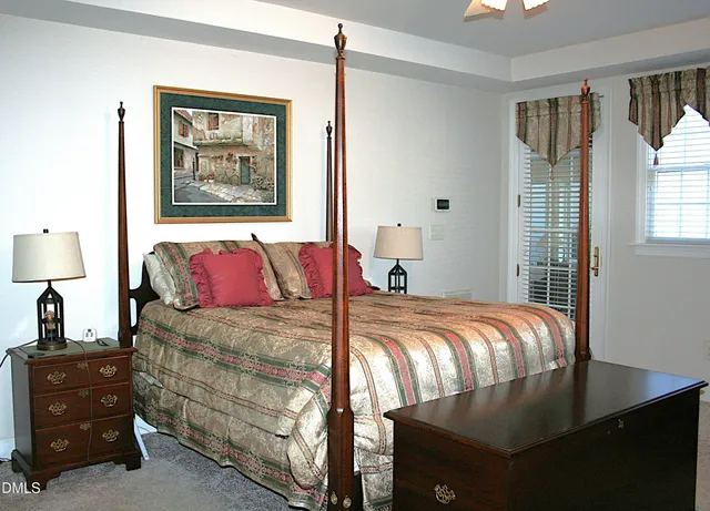 a bed room with a bed and a chandelier