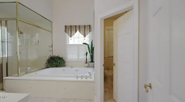 a bathroom with a double vanity sink and mirror