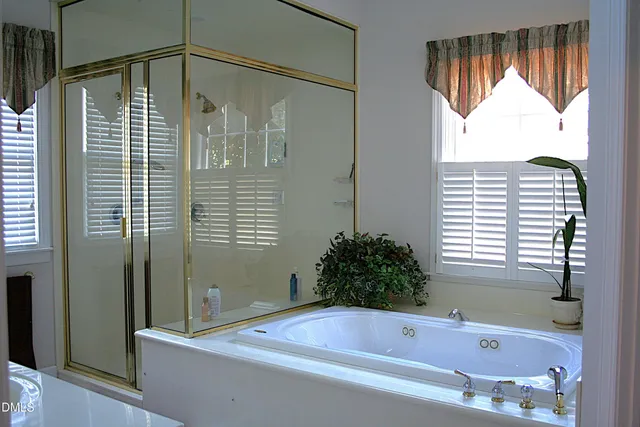 a bathroom with a shower and a sink