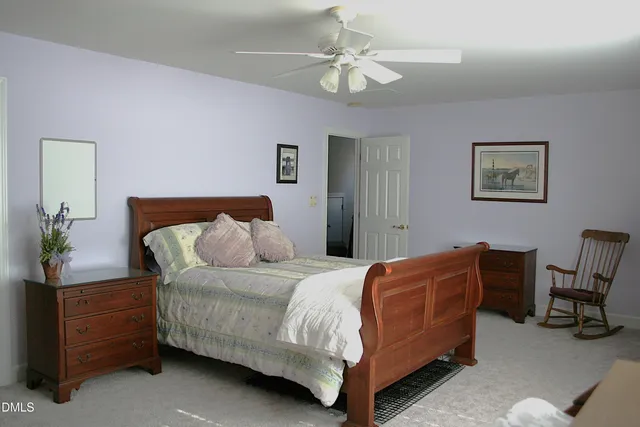 a view of a swimming pool with an outdoor space and seating area
