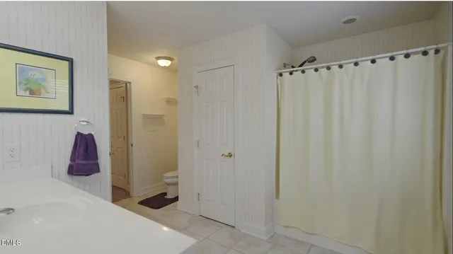 a room with lots of furniture and a chandelier