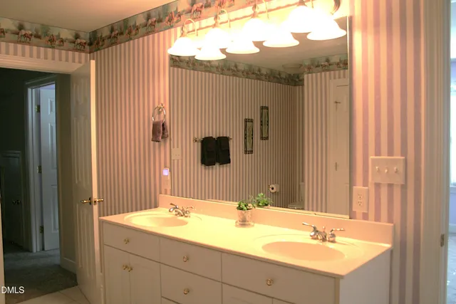 a view of a backyard with wooden fence