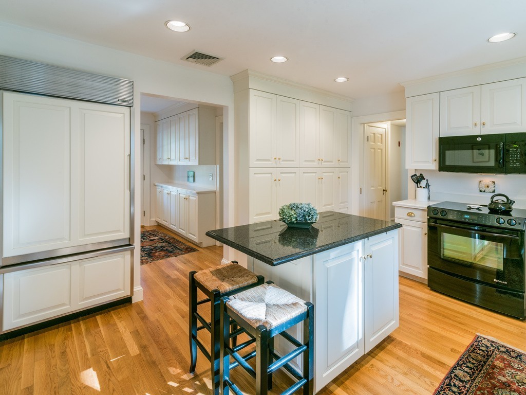 80 Dean Road Weston, MA 02493 - Photo 11 of 28 a kitchen with stainless steel appliances granite countertop a stove and a refrigerator