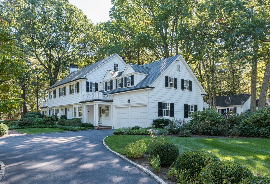 80 Dean Road Weston, MA 02493 - Photo 2 of 28 a front view of a house with a yard